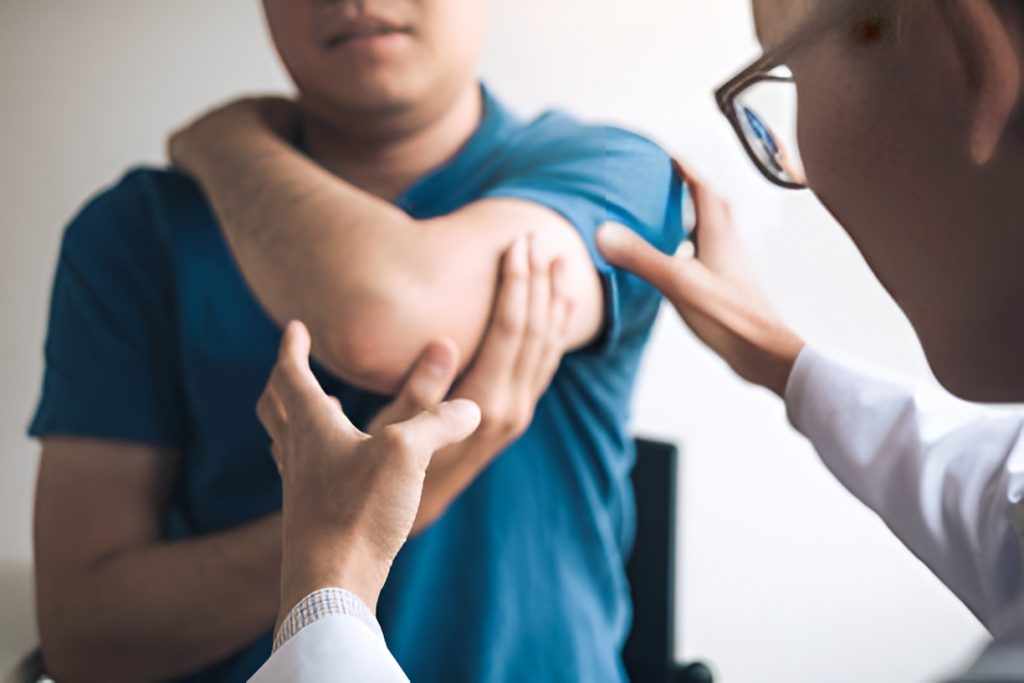 doctor checking a patient's left arm